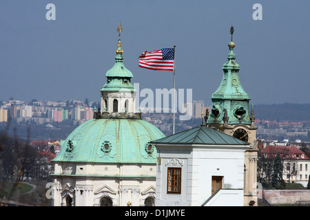 U.S. Embassy in Prague.  In the background the church of St. Nicholas, Mala Strana, Prague Stock Photo