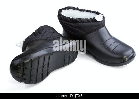 Black rubber female shoes on a white background