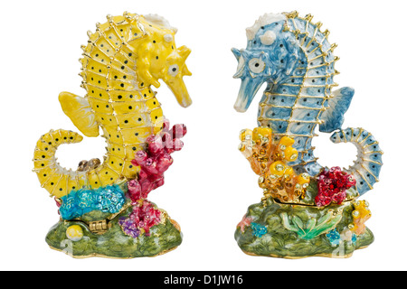 Porcelain figures of two Sea Horses of small fishes in love. Mass production sculptures are decorated with color enamel, gold pa Stock Photo