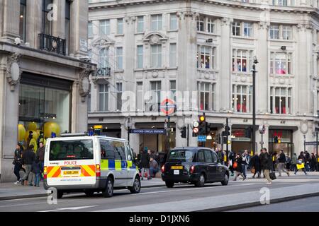 London, UK. 26th December 2012 Due to the two stabbings last year on Oxford Street there were more police officers on duty patrolling in London’s busiest shopping areas. Stock Photo