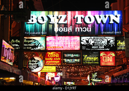 Night scene of illuminated neon signs in Boyz Town in the Red Light District of Pattaya, Thailand Stock Photo