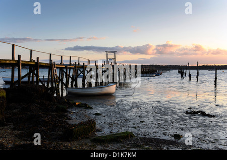 Sunset at a wooden jetty in Poole harbour Stock Photo