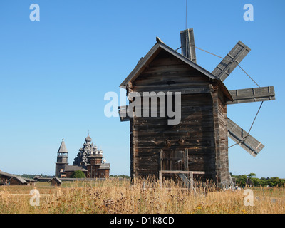 Windmill and Kizhi Pogost at Kizhi Island in Lake Onega, open-air Museum of Karelian Wooden Architecture Stock Photo