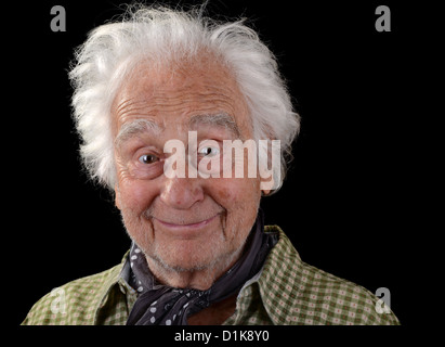 funny old man wearing a green checked shirt with white hair smiling Stock Photo