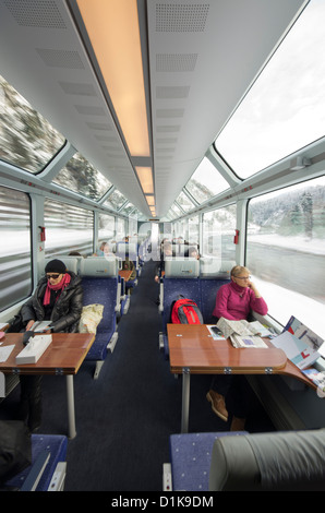 Passengers on the Glacier Express Train near Oberwald, Switzerland. Stock Photo