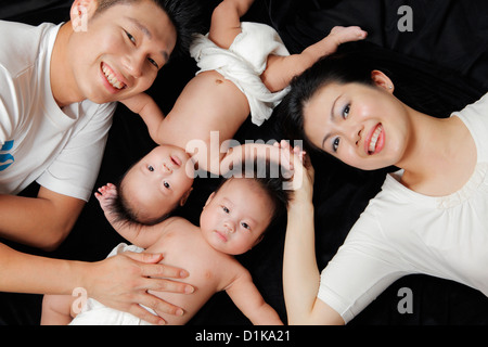 Top view of mother, father and their twin babies Stock Photo