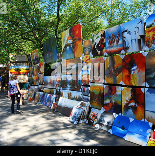 Weekly open air art market  on the railings along Green Park, Piccadilly, London, UK,  on a sunny Summer weekend. Stock Photo