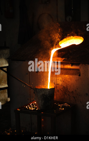 Foundry - molten metal poured from lathe for casting - still life Stock Photo