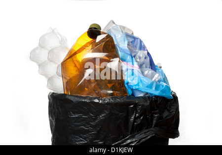 Full trash bin, isolated on white Stock Photo