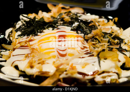 Okonomiyaki is japanese pizza , japanese cuisine Stock Photo