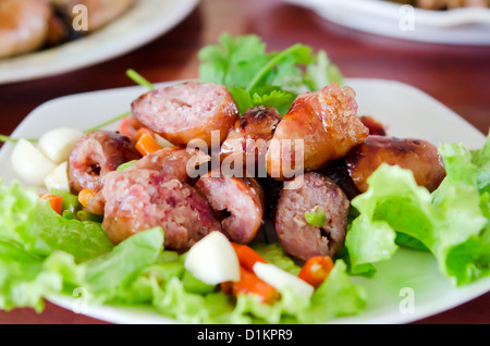 fried Thai sausage served with chili and fresh vegetable Stock Photo
