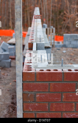 Keeping the corner of a new home plumb during contruction Stock Photo