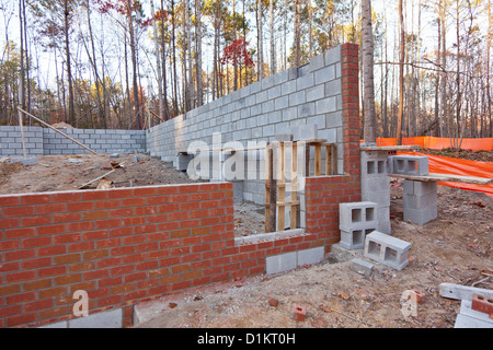 Constructing brick walls for the basement of a new home Stock Photo
