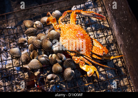 Seafood, crab and mussels (shellfish), grilled on charcoal Stock Photo