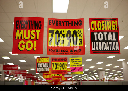 everything must go total liquidation closing signs in a store in Saskatoon saskatchewan canada Stock Photo