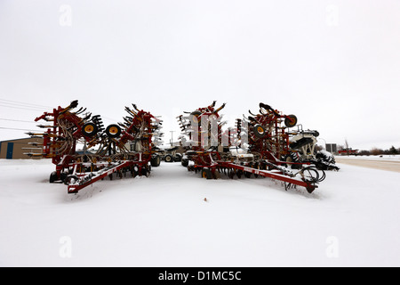 new bourgault 5710 air hoe drill covered in snow in winter Kamsack Saskatchewan Canada Stock Photo