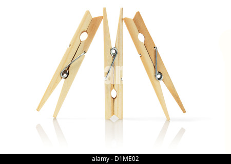 Three Wooden Clothes Pegs Standing on White Background Stock Photo