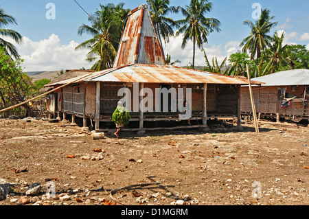 INDONESIA, Sumba, Maudolung, typical house with corrugated iron roof Stock Photo