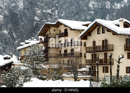 Blocks of tourist chalets, after a heavy snowfall, Italy Stock Photo