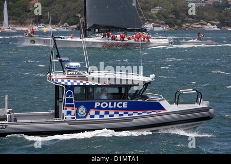 Australian police boat patrolling in sydney harbour as wildoats x1 prepares for the start of the 2012 sydney to hobart yacht Stock Photo