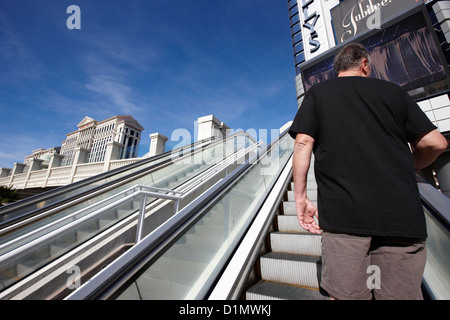 man riding on escalators on Las Vegas boulevard Nevada USA Stock Photo