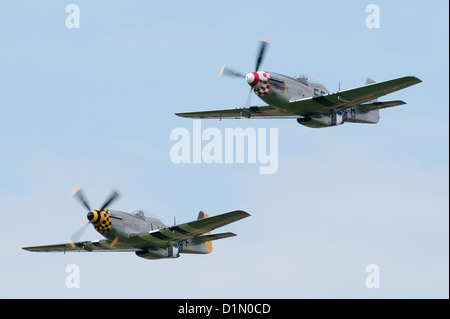 Two restored P-51 Mustang WWII fighters making a formation pass at the Sywell Air Show 2012 Stock Photo