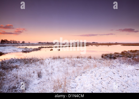 dramatic sunrise over river in winter Stock Photo