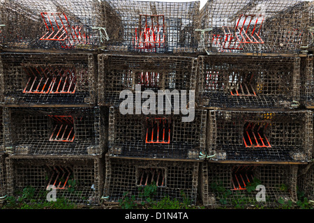 rectangular lobster pots stacked on the beach at Warsash Stock Photo