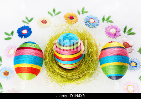 Handmade Easter eggs on an embroidered tablecloth Stock Photo