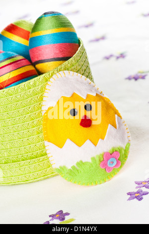 Handmade Easter decorations on an embroidered tablecloth Stock Photo