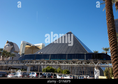 mandalay bay monorail passing luxor resort hotel and casino Las Vegas Nevada USA Stock Photo