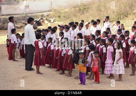 Indian school teacher with children Andhra Pradesh South India Stock Photo