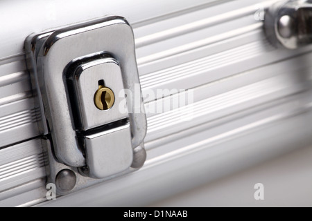 Detail on the lock of a metal suitcase Stock Photo