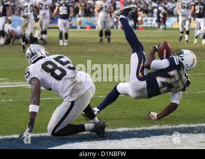 San Diego Chargers' Quentin Jammer intercepts a pass intended for Seattle  Seahawks' Mike Williams (17) as Chargers' Eric Weddle looks on in the first  half of an NFL football game, Sunday, Sept.