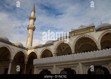 Minaret in sun from inner courtyard with ablution fountain at Suleymaniye Mosque Istanbul Turkey Stock Photo