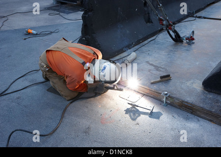 man welding metal plates together on the street Las Vegas Nevada USA Stock Photo