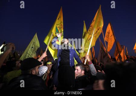 Dec. 31, 2012 - Gaza City, Gaza Strip - Palestinian supporters of the Fatah movement hold the party's flags during a rally to mark its anniversary in the Hamas-ruled enclave. (Credit Image: © Majdi Fathi/APA Images/ZUMAPRESS.com) Stock Photo