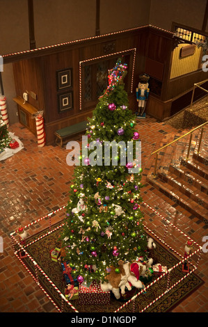 Tall Christmas tree and presents viewed from the balconey of the second floor Stock Photo