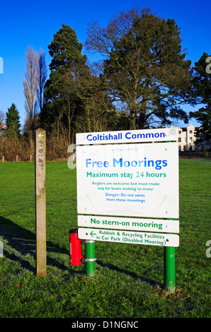 A sign indicating free moorings by the river Bure at Coltishall Common, Norfolk, England, United Kingdom. Stock Photo