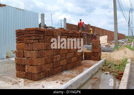 Laterite bricks for the construction of a brick wall. Stock Photo