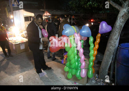 Dec. 31, 2012 - Gaza, Gaza Strip, Palestinian Territory - A Palestinian vendor sells balloons, during take part in celebrations of the New Year's Eve festivities in the Gaza city of on Dec. 31, 2012  (Credit Image: © Ezz Al-Zanoon/APA Images/ZUMAPRESS.com) Stock Photo