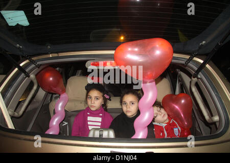 Jan. 1, 2013 - Gaza, Gaza Strip, Palestinian Territory - Palestinian children hold Balloons during take part in celebrations of the New Year's Eve festivities in the Gaza city of on Dec. 31, 2012  (Credit Image: © Ezz Al-Zanoon/APA Images/ZUMAPRESS.com) Stock Photo