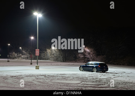 One Car In Lonely Snowy Parking Lot Stock Photo