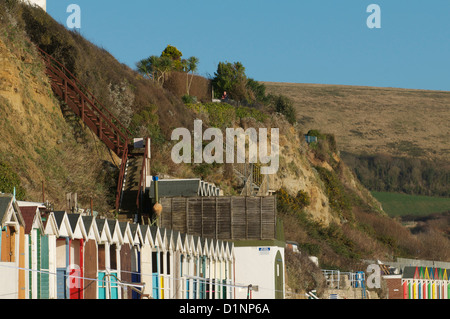 Swanage cliffs and beach huts at the northern end of Swanage bay Stock Photo