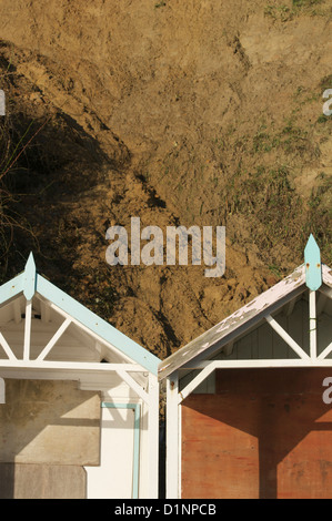 Swanage cliffs and beach huts at the northern end of Swanage bay Stock Photo