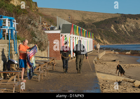 Swanage cliffs and beach huts at the northern end of Swanage bay Stock Photo