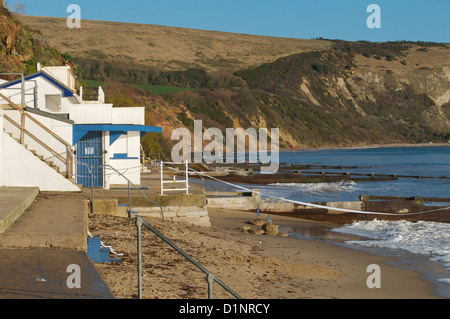 Swanage cliffs and beach huts at the northern end of Swanage bay Stock Photo