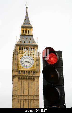 Red for stop British traffic light / signal in London, with Big Ben tower and clock / Parliament behind. UK. Stock Photo