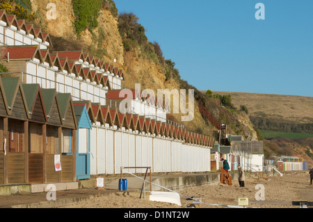 Swanage cliffs and beach huts at the northern end of Swanage bay Stock Photo