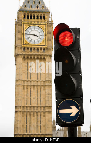 Red for stop British traffic light / signal in London, with Big Ben tower and clock / Parliament behind. UK. Stock Photo